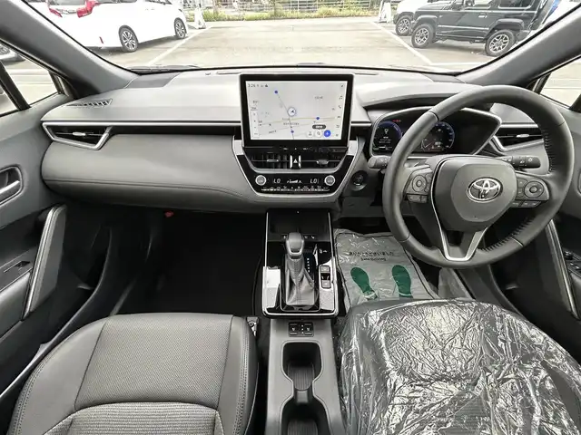 トヨタ カローラ クロス ハイブリッド Z 愛媛県 2025(令7)年 0.1千km 茶 純正10.5型ディスプレイオーディオ/全周囲カメラ/半革温冷電動シート/トヨタセーフティセンス/シグナルロードプロジェクション/レーダークルーズコントロール/ブラインドスポットモニター/アドバンストパーク/ワイヤレス充電/電動リアゲート/ステアリングヒーター/ステアリングリモコン/電格ミラー/ヒートミラー/ルーフレール/ETC2.0/電動パーキングブレーキ/TypeC入力端子/現状サマー(純正AW)(225/50R18)/MICHELIN PRIMACY4