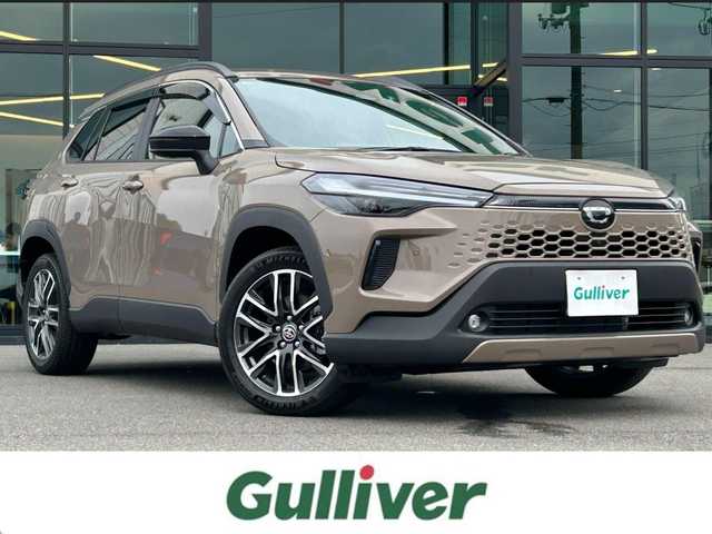 トヨタ カローラ クロス ハイブリッド Z 愛媛県 2025(令7)年 0.1千km 茶 純正10.5型ディスプレイオーディオ/全周囲カメラ/半革温冷電動シート/トヨタセーフティセンス/シグナルロードプロジェクション/レーダークルーズコントロール/ブラインドスポットモニター/アドバンストパーク/ワイヤレス充電/電動リアゲート/ステアリングヒーター/ステアリングリモコン/電格ミラー/ヒートミラー/ルーフレール/ETC2.0/電動パーキングブレーキ/TypeC入力端子/現状サマー(純正AW)(225/50R18)/MICHELIN PRIMACY4