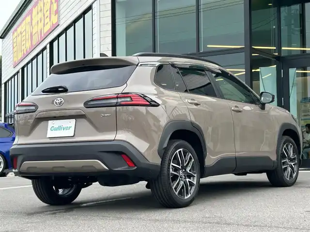 トヨタ カローラ クロス ハイブリッド Z 愛媛県 2025(令7)年 0.1千km 茶 純正10.5型ディスプレイオーディオ/全周囲カメラ/半革温冷電動シート/トヨタセーフティセンス/シグナルロードプロジェクション/レーダークルーズコントロール/ブラインドスポットモニター/アドバンストパーク/ワイヤレス充電/電動リアゲート/ステアリングヒーター/ステアリングリモコン/電格ミラー/ヒートミラー/ルーフレール/ETC2.0/電動パーキングブレーキ/TypeC入力端子/現状サマー(純正AW)(225/50R18)/MICHELIN PRIMACY4