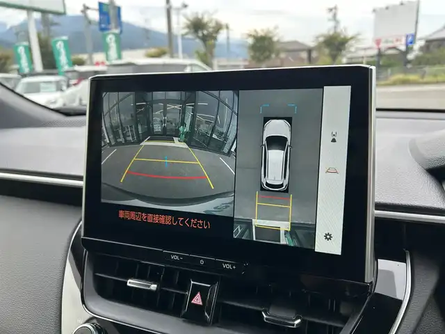 トヨタ カローラ クロス ハイブリッド Z 愛媛県 2025(令7)年 0.1千km 茶 純正10.5型ディスプレイオーディオ/全周囲カメラ/半革温冷電動シート/トヨタセーフティセンス/シグナルロードプロジェクション/レーダークルーズコントロール/ブラインドスポットモニター/アドバンストパーク/ワイヤレス充電/電動リアゲート/ステアリングヒーター/ステアリングリモコン/電格ミラー/ヒートミラー/ルーフレール/ETC2.0/電動パーキングブレーキ/TypeC入力端子/現状サマー(純正AW)(225/50R18)/MICHELIN PRIMACY4