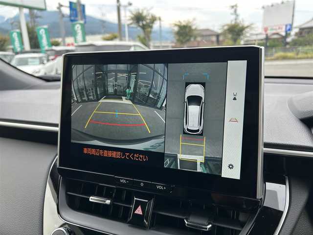トヨタ カローラ クロス ハイブリッド Z 愛媛県 2025(令7)年 0.1千km 茶 純正10.5型ディスプレイオーディオ/全周囲カメラ/半革温冷電動シート/トヨタセーフティセンス/シグナルロードプロジェクション/レーダークルーズコントロール/ブラインドスポットモニター/アドバンストパーク/ワイヤレス充電/電動リアゲート/ステアリングヒーター/ステアリングリモコン/電格ミラー/ヒートミラー/ルーフレール/ETC2.0/電動パーキングブレーキ/TypeC入力端子/現状サマー(純正AW)(225/50R18)/MICHELIN PRIMACY4