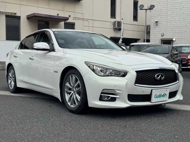 日産 スカイライン ハイブリッド 350GT Type P 岡山県 2015(平27)年 10.4万km クリスタルホワイトパール 登録時走行距離103618キロ/純正メモリナビ/AM/FM/BT/TV/インテリジェントクルーズコントロール/アラウンドビューモニター/コーナーセンサー/パワーシート（運転席、助手席）/シートヒーター（運転席、助手席）/アイドリングストップ/社外17インチAW/純正フロアマット/プッシュスタート/スマートキー/ETC