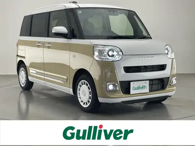 ダイハツ ムーヴ キャンバス ストライプス G 愛知県 2024(令6)年 0.8万km シャイニングホワイトパール/サンドベージュメタリック 社外ナビ　スマアシIII　シートヒーター　全方位カメラ　禁煙車　フルセグＴＶ　ＤＶＤ　Ｂｌｕｅｔｏｏｔｈ　ＵＳＢ　ドリンクホルダーヒーター　両側パワスラ　オートハイビーム　車線逸脱　衝突軽減　ＬＥＤライト　フォグランプ　社外マット カーテンエアバッグ