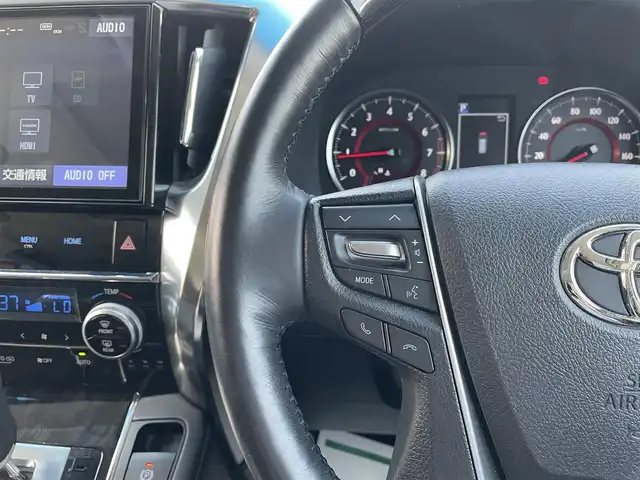 トヨタ ヴェルファイア Z Gエディション 千葉県 2019(令1)年 1.8万km ホワイトパールクリスタルシャイン エアロ/サンルーフ/黒レザーシート/純正10インチSDナビ/・CD/DVD/MSV/Bluetooth/フルセグ/純正12.1インチフリップダウンモニター【V12T-R68C】/両後パワースライドドア/パワーバックドア/前席パワーシート/前席シートヒーター/前席シートベンチレーション/デジタルインナーミラー/トヨタセーフティーセンス/・プリクラッシュセーフティー/・レーンディパーチャーアラート/・パーキングサポートブレーキ/・ロードサインアシスト/・ブラインドスポットモニター/アダプティブクルーズコントロール/ステアリングヒーター/スマートキー/前後コーナーセンサー/AC100V100W電源/純正ドライブレコーダー【DRT-H68A】/ビルトインETC/純正18インチアルミホイール/ウッドコンビステアリング/純正LEDヘッドライト/フォグランプ/サイド＆カーテンエアバッグ/ドアバイザー/新車時保証書＆取扱説明書