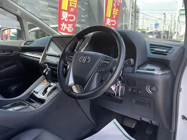 トヨタ ヴェルファイア Z Gエディション 千葉県 2019(令1)年 1.8万km ホワイトパールクリスタルシャイン エアロ/サンルーフ/黒レザーシート/純正10インチSDナビ/・CD/DVD/MSV/Bluetooth/フルセグ/純正12.1インチフリップダウンモニター【V12T-R68C】/両後パワースライドドア/パワーバックドア/前席パワーシート/前席シートヒーター/前席シートベンチレーション/デジタルインナーミラー/トヨタセーフティーセンス/・プリクラッシュセーフティー/・レーンディパーチャーアラート/・パーキングサポートブレーキ/・ロードサインアシスト/・ブラインドスポットモニター/アダプティブクルーズコントロール/ステアリングヒーター/スマートキー/前後コーナーセンサー/AC100V100W電源/純正ドライブレコーダー【DRT-H68A】/ビルトインETC/純正18インチアルミホイール/ウッドコンビステアリング/純正LEDヘッドライト/フォグランプ/サイド＆カーテンエアバッグ/ドアバイザー/新車時保証書＆取扱説明書
