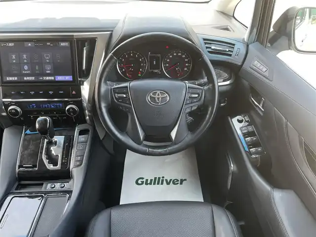 トヨタ ヴェルファイア Z Gエディション 千葉県 2019(令1)年 1.8万km ホワイトパールクリスタルシャイン エアロ/サンルーフ/黒レザーシート/純正10インチSDナビ/・CD/DVD/MSV/Bluetooth/フルセグ/純正12.1インチフリップダウンモニター【V12T-R68C】/両後パワースライドドア/パワーバックドア/前席パワーシート/前席シートヒーター/前席シートベンチレーション/デジタルインナーミラー/トヨタセーフティーセンス/・プリクラッシュセーフティー/・レーンディパーチャーアラート/・パーキングサポートブレーキ/・ロードサインアシスト/・ブラインドスポットモニター/アダプティブクルーズコントロール/ステアリングヒーター/スマートキー/前後コーナーセンサー/AC100V100W電源/純正ドライブレコーダー【DRT-H68A】/ビルトインETC/純正18インチアルミホイール/ウッドコンビステアリング/純正LEDヘッドライト/フォグランプ/サイド＆カーテンエアバッグ/ドアバイザー/新車時保証書＆取扱説明書