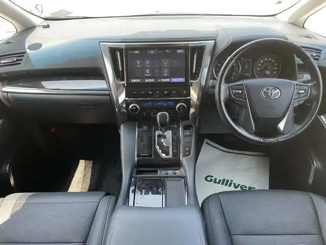 トヨタ ヴェルファイア Z Gエディション 千葉県 2019(令1)年 1.8万km ホワイトパールクリスタルシャイン エアロ/サンルーフ/黒レザーシート/純正10インチSDナビ/・CD/DVD/MSV/Bluetooth/フルセグ/純正12.1インチフリップダウンモニター【V12T-R68C】/両後パワースライドドア/パワーバックドア/前席パワーシート/前席シートヒーター/前席シートベンチレーション/デジタルインナーミラー/トヨタセーフティーセンス/・プリクラッシュセーフティー/・レーンディパーチャーアラート/・パーキングサポートブレーキ/・ロードサインアシスト/・ブラインドスポットモニター/アダプティブクルーズコントロール/ステアリングヒーター/スマートキー/前後コーナーセンサー/AC100V100W電源/純正ドライブレコーダー【DRT-H68A】/ビルトインETC/純正18インチアルミホイール/ウッドコンビステアリング/純正LEDヘッドライト/フォグランプ/サイド＆カーテンエアバッグ/ドアバイザー/新車時保証書＆取扱説明書