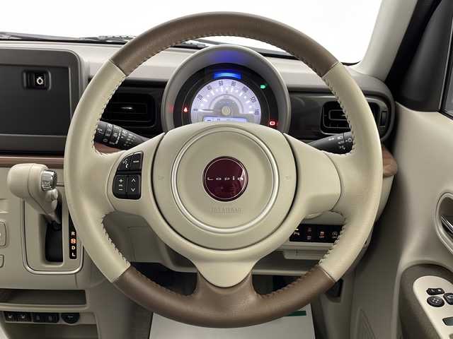 スズキ ラパン ＬＣ X 宮崎県 2022(令4)年 0.1万km テラコッタピンクメタリック/アーバンブラウン 2トーン 禁煙車/衝突被害軽減ブレーキ/純正セキュリティアラーム/純正LEDオートライト/レーンディパーチャーアラート/クリアランスソナー/エネチャージ/ハーフレザーシート/前席シートヒーター/本革巻ハンドル/リアプライバシーガラス/ウインカードアミラー/電動格納ミラー/オートエアコン/スマートキー/プッシュエンジンスタート/スペアキー/新車時保証書/取扱い説明書