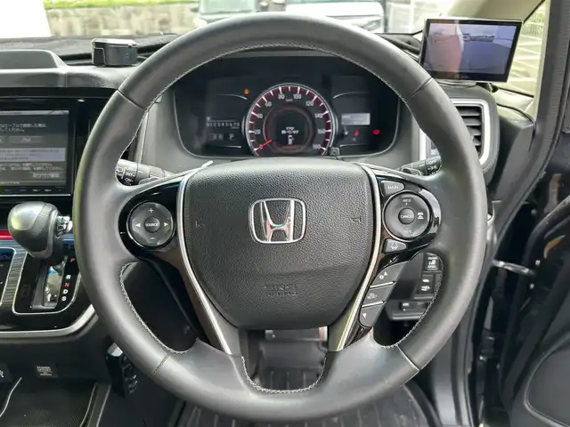 ホンダ オデッセイ アブソルート・EXホンダセンジング 佐賀県 2016(平28)年 6.5万km クリスタルブラックパール 無限フルエアロ/無限マフラー/ホンダセンシング/ブラインドスポットインフォメーション/純正8型ナビ/・バックカメラ/・フルセグTV/BT/CD/DVD/アルパイン後席モニター(接続確認できず）/ハーフレザーシート/パワーシート/両側パワースライドドア/純正エンジンスターター/ETC/LEDヘッドライト/オートライト/社外前後ドラレコ(ZDR035)/社外フロント/左サイドカメラ/社外パワーバックドア/フロント3面断熱フィルム(証明書あり)/スペアキー×１/取扱説明書/保証書