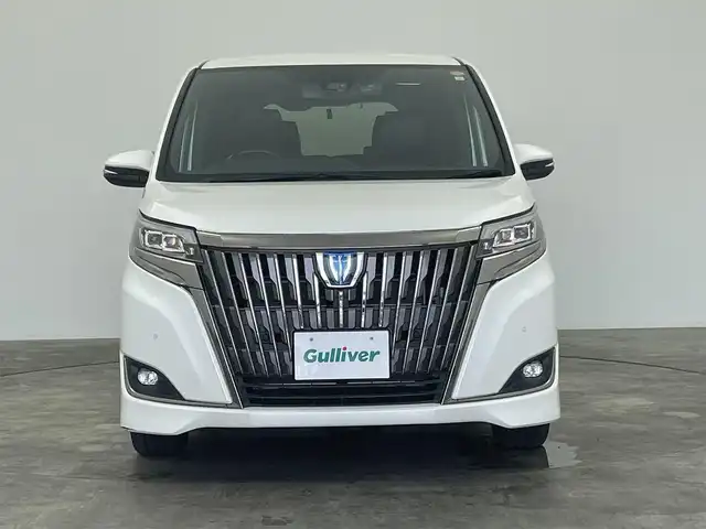 トヨタ エスクァイア ハイブリッド Gi プレミアムパッケージ ブラックテーラード 群馬県 2021(令3)年 1.6万km ホワイトパールクリスタルシャイン 純正ナビ　バックカメラ　フリップダウンモニター　両側パワースライドドア　衝突軽減　レーンアシスト　オートマチックハイビーム　ステアリングヒーター　シートヒーター　ビルトインETC　禁煙車
