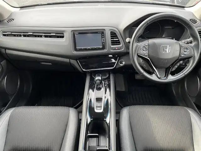 ホンダ ヴェゼル ハイブリッド Z ホンダセンシング 埼玉県 2018(平30)年 4.5万km ミッドナイトブルービームM ホンダセンシング　純正７インチナビ　フルセグＴＶ　Ｂｌｕｅｔｏｏｔｈ　バックカメラ　ブラックハーフレザーシート　前席シートヒーター　革巻きステアリング　パドルシフト　ビルトインＥＴＣ　ドラレコ