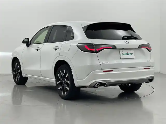 ホンダ ＺＲ－Ｖ ハイブリッド e:HEV Z 熊本県 2024(令6)年 1.9万km プラチナホワイトパール 純正ナビ　/全周囲カメラ　/前後ドライブレコーダー　/ビルトインＥＴＣ２．０　/前後クリアランスソナー　/前席シートヒーター　/前席パワーシート　/パワーバックドア　/ステアリングヒーター　/ホンダセンシング/・路外逸脱制御機能/・ブラインドスポットモニター/・踏み間違い軽減システム/・衝突軽減ブレーキ/・レーダークルーズコントロール/・レーンキープアシスト/横滑り防止/ダウンヒルアシスト/社外ゴムフロアマット/純正１８インチAW/オートライト/LEDヘッドライト/フォグライト/スマートキー/プッシュスタート/保証書