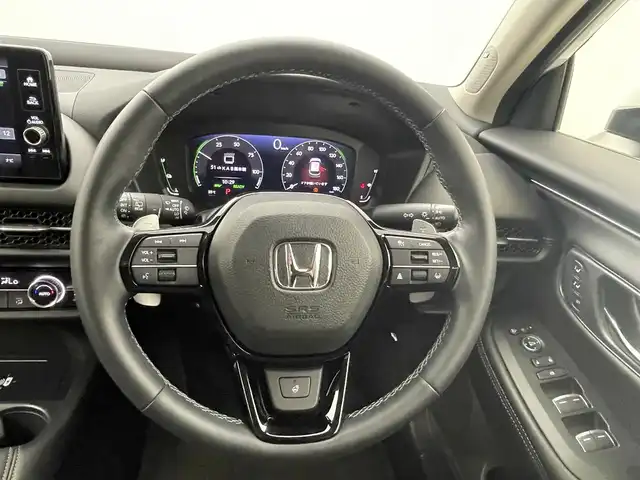 ホンダ ＺＲ－Ｖ ハイブリッド e:HEV Z 熊本県 2024(令6)年 1.9万km プラチナホワイトパール 純正ナビ　/全周囲カメラ　/前後ドライブレコーダー　/ビルトインＥＴＣ２．０　/前後クリアランスソナー　/前席シートヒーター　/前席パワーシート　/パワーバックドア　/ステアリングヒーター　/ホンダセンシング/・路外逸脱制御機能/・ブラインドスポットモニター/・踏み間違い軽減システム/・衝突軽減ブレーキ/・レーダークルーズコントロール/・レーンキープアシスト/横滑り防止/ダウンヒルアシスト/社外ゴムフロアマット/純正１８インチAW/オートライト/LEDヘッドライト/フォグライト/スマートキー/プッシュスタート/保証書