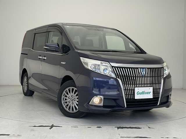 トヨタ エスクァイア ハイブリッド Gi 沖縄県 2015(平27)年 7.2万km ダークバイオレットマイカメタリック 純正ナビ（NSZT-W64）　/（フルセグＴＶ　ＣＤ　ＤＶＤ　Ｂｌｕｅｔｏｏｔｈ）　/ＥＴＣ　/バックカメラ　/前方ドライブレコーダー/クルーズコントロール　/両側パワースライドドア　/スマートキー　/前席シートヒーター　/純正アルミホイール15インチ