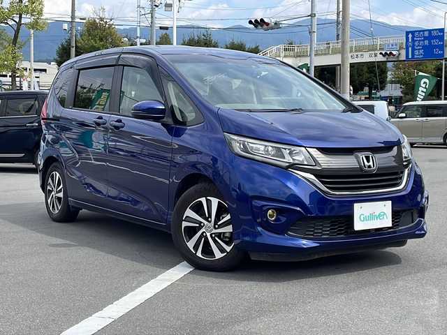ホンダ フリード G ホンダセンシング 長野県 2017(平29)年 2.3万km コバルトブルーパール ホンダセンシング/・衝突軽減ブレーキ/・アダプティブクルーズコントロール/・車線維持支援システム/・歩行者事故低減ステアリング/・路外逸脱抑制機能/・誤発進抑制機能/・先行車発進お知らせ機能/・標識認識機能/社外8インチメモリナビ【AVIC-RL900】/(CD/DVD/フルセグTV/SD/BT)/バックカメラ/ビルトインETC/ドライブレコーダー/後部座席9インチプライベートモニター【TVM-PW900】/両側パワースライドドア/革巻きステアリング/ステアリングスイッチ/オートライト/スマートキー/Pスタート/電動格納ミラー/純正フロアマット/純正15インチAW/ドアバイザー