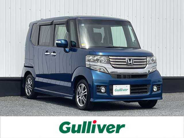 ホンダ Ｎ ＢＯＸ カスタム G Lパッケージ 千葉県 2013(平25)年 2.9万km プレミアムダイナミックブルーパール 社外メモリナビ/(フルセグTV/CD/DVD/FM/AM)/バックカメラ/片側パワースライドドア/横滑り防止装置/オートライト/ウィンカーミラー/電動格納ミラー/純正14インチAW/シートリフター/プッシュスタート/スマートキー/フロアマット/ドアバイザー/スペアキー/取扱説明書/保証書