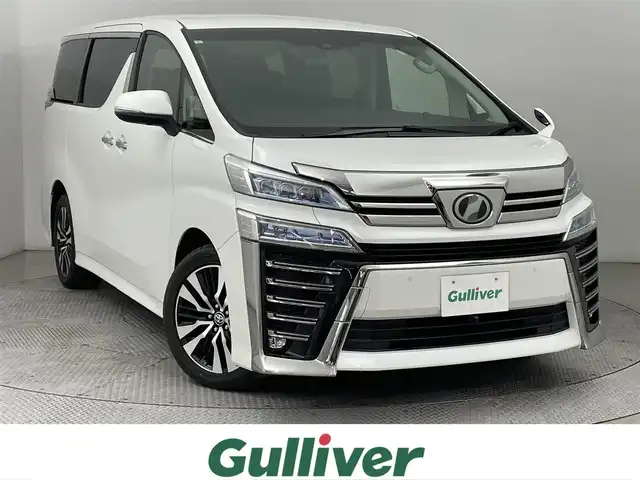 トヨタ ヴェルファイア Z Gエディション 道央・札幌 2019(令1)年 5.9万km ホワイトパールクリスタルシャイン ・4WD/・純正10インチSDナビ（NSZN-Z68T）/　CD/DVD/SD/Bt/USB/HDMI/フルセグ/・フロント、バックカメラ/・純正フリップダウンモニター（前後個別再生）/・両側電動スライドドア/・デジタルインナーミラー/・レーダークルーズコントロール/・プリクラッシュセーフティ/・レーンキープアシスト/・LEDヘッドライト/・オートハイビーム/・ブラインドスポットモニター/・レザーシート/・シートヒーター（D/N）/・ベンチレーション（D/N）/・シートメモリー（D）/・ステアリングヒーター/・オートブレーキホールド/・電動リアゲート/・ビルトインETC（2.0）/・保証書、取説（有）/・スペアキーｘ１