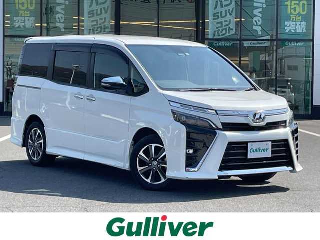 トヨタ ヴォクシー ZS 煌Ⅱ 岡山県 2020(令2)年 5.8万km 白 ワンオーナー/純正10インチSDナビ/(CD/DVD/フルセグTV/Bluetooth)/バックカメラ/後席用12インチフリップダウンモニター/両側パワースライドドア/トヨタセーフティセンス/・プリクラッシュセーフティ/・レーンディパーチャーアラート/・オートマチックハイビーム/・先行車発進告知/クルーズコントロール/インテリジェントクリアランスソナー/LEDオートヘッドライト/バックドアイージークローズ/ETC/プッシュスタート/スマートキー×2/禁煙車