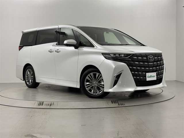 トヨタ アルファードハイブリット Z 埼玉県 2024(令6)年 0.4万km プラチナホワイトパールマイカ メーカーディスプレイオーディオ＋ナビ（TV/BT)/アラウンドビューカメラ/HDU/BSM/FCTA/LCA/トヨタチームメイト緊急時操舵支援システム/フル液晶メーター/置くだけ充電/HDMI端子/両側パワースライドドア/パワーバックドア/追従型クルーズコントロール/純正18インチアルミホイール/純正フロアマット/レーンキープアシスト/衝突軽減システム/クリアランスソナー前後/パワーシート/エアーシート/電動オットマン/2.0ETC