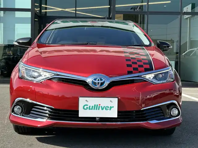 トヨタ オーリスハイブリッド 愛媛県 2016(平28)年 5.6万km レッドマイカメタリック 登録時走行距離：36098Km/トヨタセーフティセンス/純正ナビ/横滑り防止装置/衝突軽減システム/レーンキープアシスト/エンジンスタートボタン/Bカメラ/前ドラレコ/純正ETC/ＡＢS/ハーフレザーシート/LEDヘッドライト/オートライト/スマートキー/純正アルミホイール