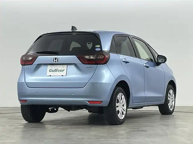 ホンダ フィット e:HEVホーム 福島県 2021(令3)年 5.9万km ライトブルー ホンダセンシング/・衝突軽減ブレーキ/・誤発進抑制機能/・後方誤発進抑制機能/・近距離衝突軽減ブレーキ/・路外逸脱抑制機能/・渋滞追従機能付アダプティブ・クルーズ・コントロール/・車線維持支援システム/・先行車発進お知らせ機能/・標識認識機能/コンフォートビューパッケージ/・親水/ヒーテッドドアミラー/・熱線入りフロントウインドウ/・PTCヒーター /純正ナビゲーション/・型式：VXM-205VFEi/・【TV/Bluetooth/CD/DVD/AM・FM/・バックカメラ/・ETC/前後ドライブレコーダー/プッシュスタート/・スマートキー/・電子パーキング/・オートホールド/革巻きステアリング/・ステアリングスイッチ/LEDヘッドライト/・オートライト/・オートハイビーム/・ヘッドライトリベライザー/純正フロアマット/電動格納ウィンカーミラー/ドアバイザー