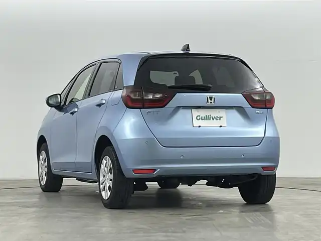 ホンダ フィット e:HEVホーム 福島県 2021(令3)年 5.9万km ライトブルー ホンダセンシング/・衝突軽減ブレーキ/・誤発進抑制機能/・後方誤発進抑制機能/・近距離衝突軽減ブレーキ/・路外逸脱抑制機能/・渋滞追従機能付アダプティブ・クルーズ・コントロール/・車線維持支援システム/・先行車発進お知らせ機能/・標識認識機能/コンフォートビューパッケージ/・親水/ヒーテッドドアミラー/・熱線入りフロントウインドウ/・PTCヒーター /純正ナビゲーション/・型式：VXM-205VFEi/・【TV/Bluetooth/CD/DVD/AM・FM/・バックカメラ/・ETC/前後ドライブレコーダー/プッシュスタート/・スマートキー/・電子パーキング/・オートホールド/革巻きステアリング/・ステアリングスイッチ/LEDヘッドライト/・オートライト/・オートハイビーム/・ヘッドライトリベライザー/純正フロアマット/電動格納ウィンカーミラー/ドアバイザー