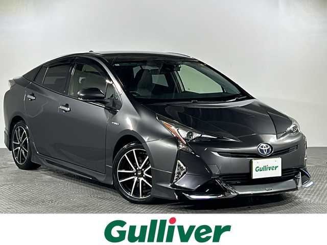 トヨタ プリウス S 沖縄県 2016(平28)年 7.6万km グレーメタリック 禁煙車　/県外仕入　/純正9インチナビ（DSZT-YC4T）/（フルセグＴＶ　Ｂｌｕｅｔｏｏｔｈ接続　ＣＤ　ＤＶＤ再生）/モデリスタエアロ/プリクラッシュセーフティー/レーダークルーズコントロール　/車線逸脱警報　/バックカメラ/ステアリングリモコン　/ドライブレコーダー　/ビルトインＥＴＣ　/レザー調シートカバー/LＥＤヘッドライト/オートライト/オートマチックハイビーム