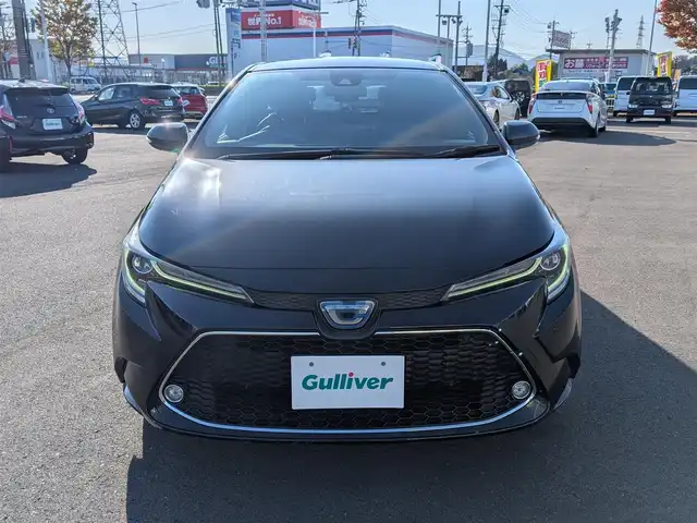 トヨタ カローラツーリング ハイブリッド ダブルバイビー 福井県 2020(令2)年 4.3万km スパークリングブラックパールクリスタルシャイン 純正9インチナビ/AM/FM/BT/USB/Miracast/バックカメラ/全車速追従機能付クルーズコントロール/コーナーセンサー/トヨタセーフティセンス/BSM/RCTA/RSA/１００V充電/ビルトインETC/シートヒーター/SOSボタン/ステアリングヒーター/純正フロアマット/オートホールド/純正17インチAW/LEDヘッドライト/Fフォグ/スマートキー