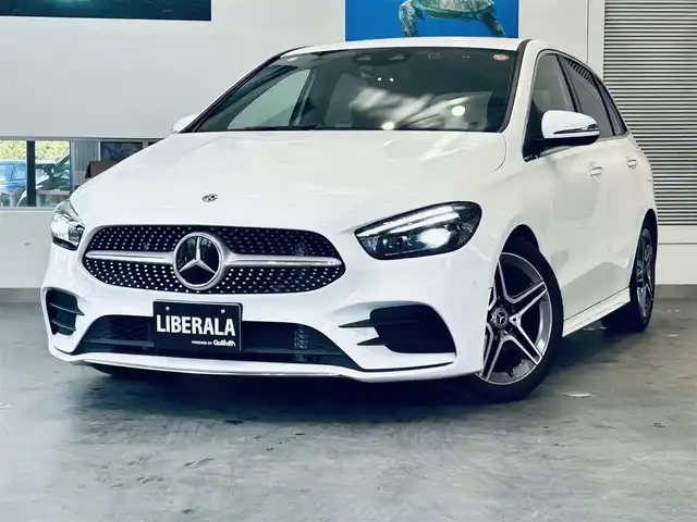 メルセデス・ベンツ Ｂ１８０ AMGライン 大阪府 2019(令1)年 1.5万km ポーラホワイト レザーエクスクルーシブP/アドバンスドP/レーダーセーフティP/HUD/ACC/純正ナビ/TV/360度カメラ/純正18インチAW/LEDヘッドライト/アンビエントライト/電動リアゲート/ブラインドスポット/赤黒革/メモリ付きパワーシート/シートヒーター/ワイヤレス充電