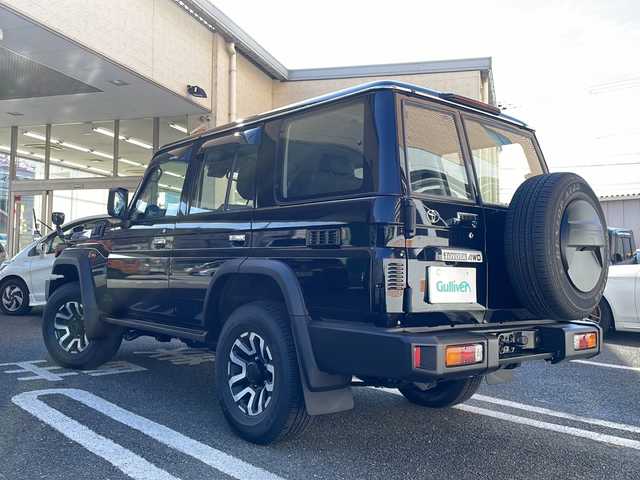 トヨタ ランドクルーザー AX 大阪府 2024(令6)年 0.1万km アティチュードブラックマイカ ワンオーナー/純正ナビ/純正フルセグTV/登録時走行距離338km/バックカメラ/４WD/クルーズコントロール/WAC/衝突軽減システム/レーンアシスト/純正アルミホイール１６インチ/MTモード付AT/ダウンヒルアシストコントロール/ETC/ドアバイザー