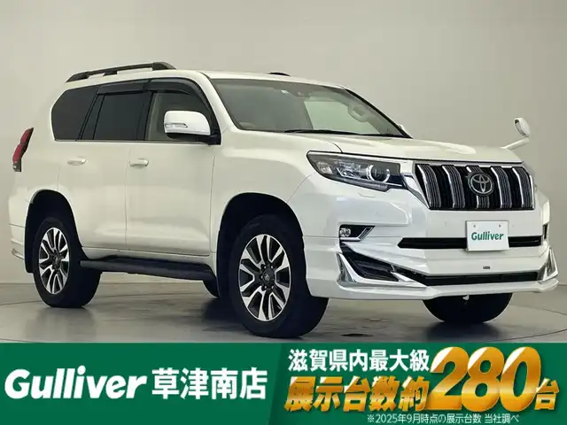 トヨタ ランドクルーザー プラド TX Lパッケージ 滋賀県 2022(令4)年 2.7万km ホワイトパールクリスタルシャイン ALPINE9インチナビ/【Bluetooth/CD/DVD/フルセグTV//HDMI/Apple CarPlay/Android Auto】/サンルーフ/レザーシート/フルモデリスタエアロ/バックカメラ/レーダークルーズコントロール/クリアランスソナー/LEDヘッドライト/オートマチックハイビーム/センターデフロック/ヒルディセントコントロール/レーンディパーチャーアラート/プリクラッシュセーフティ/前方ドライブレコーダー/D/Nパワーシート/D/Nシートヒーター/D/Nシートベンチレーション/電動格納サードシート/ビルトインETC/純正フロアマット/プッシュスタート/スマートキー/ステアリングリモコン