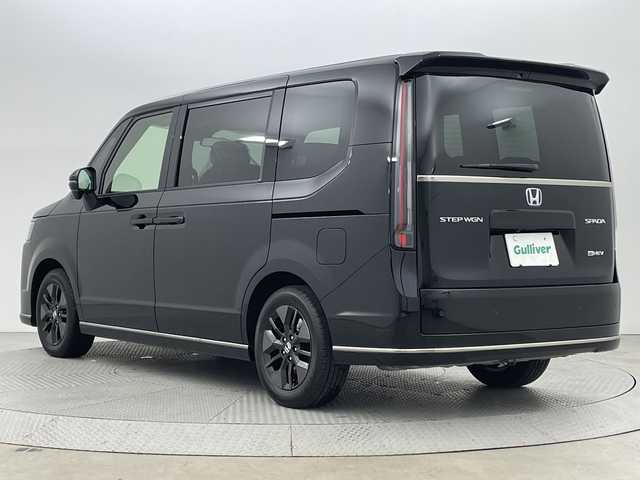 ホンダ ステップワゴン スパーダ eHEV 新潟県 2025(令7)年 0.1千km クリスタルブラックパール 15.6インチフリップダウンモニター/純正11.4インチナビ/　　フルセグ/CD/DVD/BT/バックカメラ/両側パワースライドドア/パワーバックドア/レーダークルーズコントロール/LEDオートライト/ハーフレザーシート/シートヒーター/純正16インチアルミホイール/ステアリングスイッチ/BSM/USBポート/パドルシフト/スマートキー