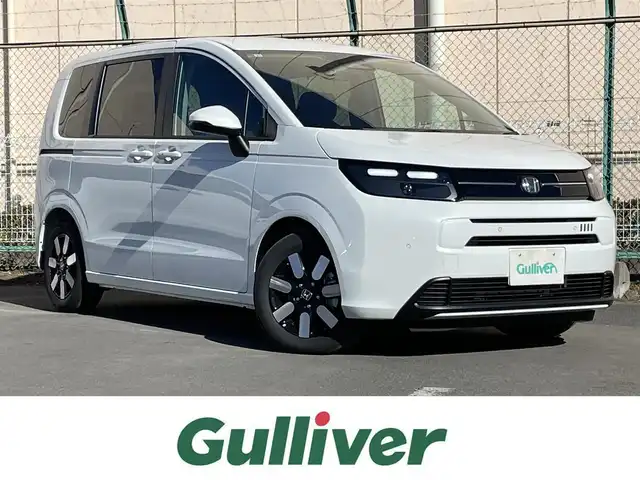 ホンダ フリード AIR EX 東京都 2025(令7)年 0.1千km プラチナホワイトパール 登録済み未使用車/純正9インチナビ/Bluetooth/USB/バックカメラ/TV/両側電動スライドドア/レーダークルーズコントロールシステム/シートヒーター/純正アルミホイール/ABS/横滑り防止装置/レーンアシスト/オートライト/純正LED/衝突被害軽減システム/BSM