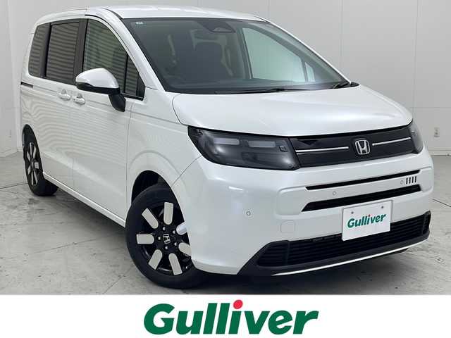 ホンダ フリード AIR EX 茨城県 2025(令7)年 0.1千km プラチナホワイトパール 純正9型メモリーナビゲーション/【LXM-242ZFNi】/フルセグ/Bluetooth/CarPlay/バックカメラ/両側電動スライドドア/ホンダセンシング/CMBS衝突軽減ブレーキ/歩行者事故低減ステアリング/アダブティブクルーズコントロール/LKAS車線維持支援システム/路外逸脱抑制機能/誤発進抑制機能/先行車発進お知らせ機能/標識認識機能/後方誤発進抑制機能/ブラインドスポットインフォメーション/踏み間違い衝突防止アシスト/前後パーキングセンサー/オートハイビーム/ハーフレザーシート/前席シートヒーター/革巻きステアリング/電動パーキングブレーキ/オートブレーキホールド/リアクーラー/ECON/プッシュスタート/スマートキー/LEDヘッドランプ/オートライト/純正15インチアルミホイール/取扱説明書/保証書