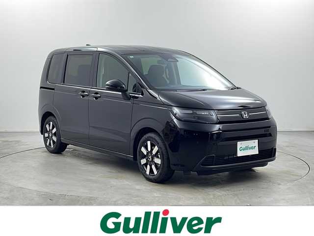 ホンダ フリード AIR EX 栃木県 2025(令7)年 0.1千km クリスタルブラックパール 登録済未使用車 /純正メモリーナビ (LXM-242ZFNi)/バックカメラ/Honda CONNECT for Gathers＋ナビ装着用スペシャルパッケージ/Honda SENSING/●衝突軽減ブレーキ（CMBS）/●先行車発進お知らせ機能/●歩行者事故低減ステアリング/●路外逸脱抑制機能●標識認識機能/●渋滞追従機能付アダプティブクルーズコントロール（ACC）/●車線維持支援システム（LKAS）/●トラフィックジャムアシスト（渋滞運転支援機能）/●ブラインドスポットインフォメーション［タイプ別設定］/●誤発進抑制機能/●後方誤発進抑制機能/●近距離衝突軽減ブレーキ/●急アクセル抑制機能/●パーキングセンサーシステム/●後退出庫サポート/両側パワースライドドア/2列目キャプテンシート(両側アームレスト付)/コンビシート(プライムスムースＸファブリック)＆専用インテリア/リアクーラー/運転席＆助手席シートヒーター/LEDヘッドライト/純正15インチアルミホイール(AIR EX専用)/サイド+カーテンエアバッグ/保証書、取扱説明書