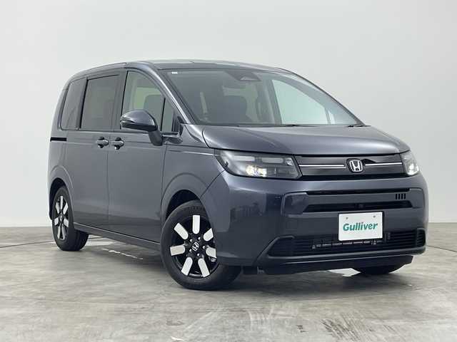 ホンダ フリード AIR EX 群馬県 2025(令7)年 0.1千km メテオロイドグレーメタリック 登録済未使用車　純正9型ナビ　全周囲カメラ　マルチビューカメラシステム　後退出庫サポート　アダプティブクルーズコントロール　両側電動スライドドア　シートヒーター　BSM　LED　衝突被害軽減ブレーキ　禁煙車