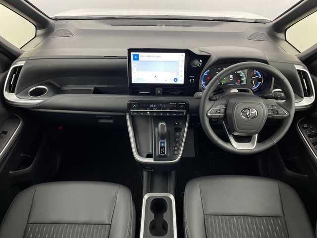 トヨタ ノア ハイブリッド S－Z 鹿児島県 2025(令7)年 0.4万km ホワイトパールクリスタルシャイン 純正ナビ/パノラマビューモニター/シートヒーター/ＣＤ/ＤＶＤ/ＨＤＭＩ/フルセグテレビ/BSM/オットマン/レーダークルーズコントロール/オートライト/プリクラッシュセーフティ/ＥＴＣ2/0/ハーフレザーシート/レーンキープ/パワーバックドア/オートハイビーム/両側パワースライドドア