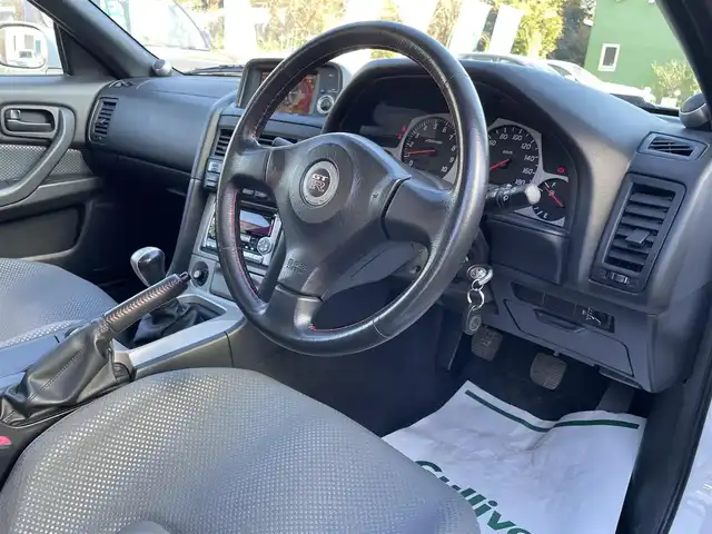 日産 スカイライン GT－R 埼玉県 1999(平11)年 1.6万km ホワイト ワンオーナー/6速MT/NISMO・エンジン・チューニング・メニュー/FUJITSUBOマフラー/ニスモLMGT4アルミホイール/社外オーディオ(CD/MD/ラジオ)/キーレスキー/記録簿(H11～R6までの車検時)/キセノンヘッドライト/フロアマット/電格ミラー/取扱説明書/保証書/スペアキー
