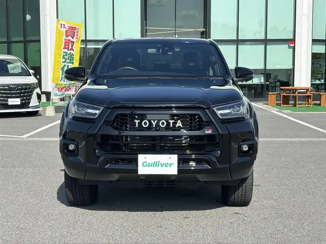 トヨタ ハイラックス Z GRスポーツ 奈良県 2024(令6)年 1.1万km アティチュードブラックマイカ 純正ナビ　/BT/USB/全方位カメラ　/パワーシート　/ハーフレザーシート　/ＥＴＣ　/追従型クルーズコントロール　/前後コーナーセンサー　/センターデフロック　/ダウンヒルアシストコントロール　/全方位ドライブレコーダー　/ＡＡＣ/スマートイー/パドルシフト/フロアマット/純正18インチアルミホイール/衝突被害軽減システム