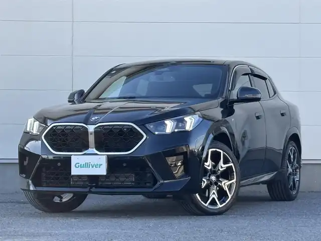 ＢＭＷ ＢＭＷ Ｘ２ xDrive 20i Mスポーツ 茨城県 2024(令6)年 1.4万km サファイアブラックP 純正ナビ/　(AM/FM/Bluetooth/AppleCarPlay)/Connected Drive/　(YouTube/Disney＋/Alexa)/全方位カメラ/全方位ドライブレコーダー/ミラー内蔵型ETC/アンビエントライト/ブラインドスポットモニター/ヘッドアップディスプレイ/前後コーナーセンサー/電動リアゲート/ハーフレザーシート/ハンドルヒーター/シートヒーター(D＋N席)/パワーシート(D＋N席)/純正フロアマット/純正アルミホイール/LEDヘッドライト/プッシュスタート