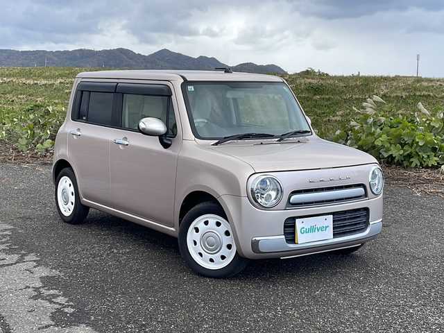 スズキ ラパン ショコラ X 新潟県 2013(平25)年 5.3万km シャンパンピンクPM 社外SDナビ(MDV-L300)/CD/DVD/ワンセグテレビ/革シート/ベンチシート/スマートキー/プッシュスタート/キセノンヘッドライト/オートライト/アイドリングストップ