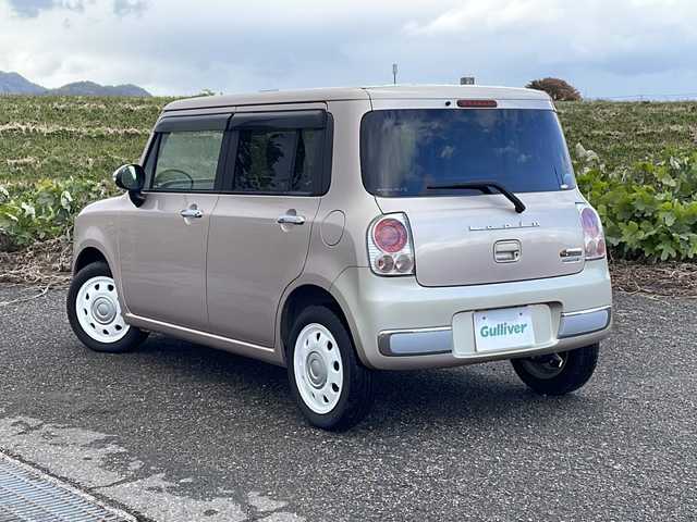 スズキ ラパン ショコラ X 新潟県 2013(平25)年 5.3万km シャンパンピンクPM 社外SDナビ(MDV-L300)/CD/DVD/ワンセグテレビ/革シート/ベンチシート/スマートキー/プッシュスタート/キセノンヘッドライト/オートライト/アイドリングストップ