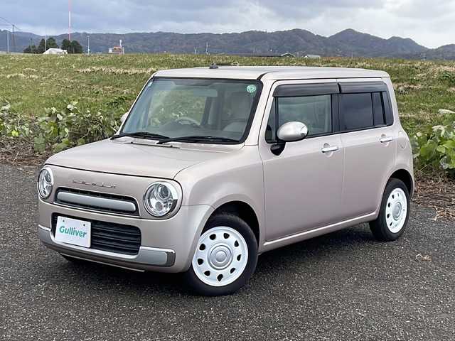 スズキ ラパン ショコラ X 新潟県 2013(平25)年 5.3万km シャンパンピンクPM 社外SDナビ(MDV-L300)/CD/DVD/ワンセグテレビ/革シート/ベンチシート/スマートキー/プッシュスタート/キセノンヘッドライト/オートライト/アイドリングストップ