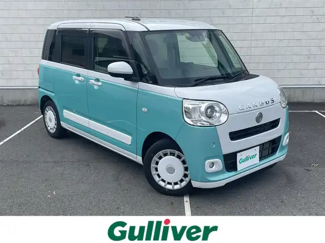 ダイハツ ムーヴ キャンバス ストライプス G 静岡県 2023(令5)年 1.4万km シャイニングホワイトパール/ファインミントメタリック 純正ナビ/　（Bluetooth/DVD/CD）/フルセグTV/バックカメラ/スマートアシスト/衝突被害軽減システム/レーンキープアシスト/前後コーナーセンサー/両側パワースライドドア/前席シートヒーター/保温機能付きカップホルダー/電動パーキングブレーキ/オートブレーキホールド/ETC/前方ドライブレコーダー/LEDヘッドライト/プッシュスタート/スマートキー/スペアキー1本有り/純正フロアマット/取扱説明書/保証書