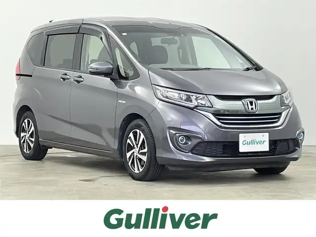 ホンダ フリード＋ ハイブリット EX 千葉県 2019(令1)年 6.5万km モダンスティールM 禁煙車/純正メモリナビ/　CD/DVD/BT/フルセグTV/両側パワースライドドア/ホンダセンシング/・衝突軽減ブレーキ〈CMBS〉/・誤発進抑制機能/・ACC〈アダプティブ・クルーズ・コントロール〉/・LKAS〈車線維持支援システム〉/・歩行者事故低減ステアリング/・路外逸脱抑制機能/・先行車発進お知らせ機能/・標識認識機能/バックカメラ/ビルトインETC/前席シートヒーター/プッシュスタート＆スマートキー/純正15インチアルミホイール/LEDヘッドライト/フォイグライト