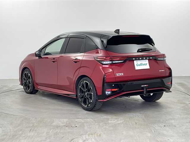 日産 オーラ ニスモ 栃木県 2023(令5)年 1.4万km ガーネットレッド/スーパーブラック 2トーン 純正ナビ　/（BT/フルセグ/Android Auto/AM/FM）/衝突軽減システム　/標識認識機能　/後退時車両検知警報　/横滑り防止　/レーダークルーズコントロール　/インテリジェントルームミラー　/ワイヤレス充電　/ＥＴＣ　/ドライブレコーダー/電動格納ミラー/純正アルミホイール/純正フロアマット/ステアリングスイッチ/プッシュスタート/スペアキー　/スマートキー