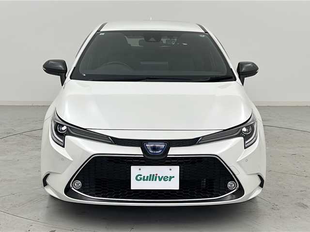 トヨタ カローラツーリング ハイブリッド ダブルバイビー 宮城県 2021(令3)年 6.8万km ホワイトパールクリスタルシャイン 禁煙車/トヨタセーフティーセンス/・プリクラッシュセーフティーシステム/・パーキングサポートブレーキ/・リアクロストラフィックアラート/・ロードサインアシスト/・レーダークルーズコントロール/・オートマチックハイビーム/ブラインドスポットモニター/純正9インチディスプレイオーディオ/（BT.CD.DVD.Applecarplay.AndroidAuto）/バックカメラ/フルセグテレビ/ビルトインETC/前後ドライブレコーダー/前席シートヒーター/ハーフレザーシート/ステアリングヒーター/電動パーキングブレーキ/AUTOHOLD/革巻きステアリング/ステアリングスイッチ/プッシュスタート/スマートキー/純正フロアマット/LEDヘッドライト/純正17インチアルミホイール/横滑り防止機能/アイドリングストップ/クリアランスソナー