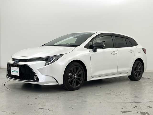 トヨタ カローラツーリング ハイブリッド ダブルバイビー 宮城県 2021(令3)年 6.8万km ホワイトパールクリスタルシャイン 禁煙車/トヨタセーフティーセンス/・プリクラッシュセーフティーシステム/・パーキングサポートブレーキ/・リアクロストラフィックアラート/・ロードサインアシスト/・レーダークルーズコントロール/・オートマチックハイビーム/ブラインドスポットモニター/純正9インチディスプレイオーディオ/（BT.CD.DVD.Applecarplay.AndroidAuto）/バックカメラ/フルセグテレビ/ビルトインETC/前後ドライブレコーダー/前席シートヒーター/ハーフレザーシート/ステアリングヒーター/電動パーキングブレーキ/AUTOHOLD/革巻きステアリング/ステアリングスイッチ/プッシュスタート/スマートキー/純正フロアマット/LEDヘッドライト/純正17インチアルミホイール/横滑り防止機能/アイドリングストップ/クリアランスソナー
