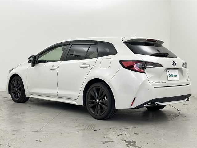 トヨタ カローラツーリング ハイブリッド ダブルバイビー 宮城県 2021(令3)年 6.8万km ホワイトパールクリスタルシャイン 禁煙車/トヨタセーフティーセンス/・プリクラッシュセーフティーシステム/・パーキングサポートブレーキ/・リアクロストラフィックアラート/・ロードサインアシスト/・レーダークルーズコントロール/・オートマチックハイビーム/ブラインドスポットモニター/純正9インチディスプレイオーディオ/（BT.CD.DVD.Applecarplay.AndroidAuto）/バックカメラ/フルセグテレビ/ビルトインETC/前後ドライブレコーダー/前席シートヒーター/ハーフレザーシート/ステアリングヒーター/電動パーキングブレーキ/AUTOHOLD/革巻きステアリング/ステアリングスイッチ/プッシュスタート/スマートキー/純正フロアマット/LEDヘッドライト/純正17インチアルミホイール/横滑り防止機能/アイドリングストップ/クリアランスソナー