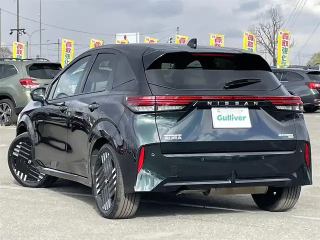 日産 オーラ G FOUR レザーエディション 道央・札幌 2024(令6)年 0.2万km パープル ４WD/寒冷地仕様/BOSEサウンドシステム/純正メーカーナビ/AM/FM/USB/BT/プロパイロット/エマージェンシーブレーキ/横滑り防止装置/レーダークルーズコントロール/レーンキープアシスト/クリアランスソナー/アラウンドビューモニター/ビルトインETC2.0/デジタルインナーミラー/EVMODE/D-MODE/D席パワーシート/前席シートヒーター/レザーシート/革巻きステアリング/ステアリングリモコン/ハンドルヒーター/電動パーキング/オートブレーキホールド/置くだけ充電/プッシュスタート/スマートキー/LEDヘッドライト/オートライト/オートハイビーム/フォグランプ/電動格納ミラー/ウィンカーミラー/純正フロアマット